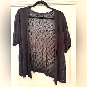 Dainty lace-like short sleeve sweater cardigan.